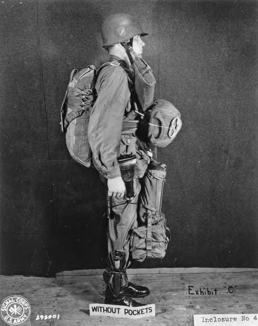 A U.S. Signal Corps photo showcasing a paratrooper demonstrating the M1942 uniform and equipment, standard for U.S. paratroopers from 1942 until its replacement in mid-1944.