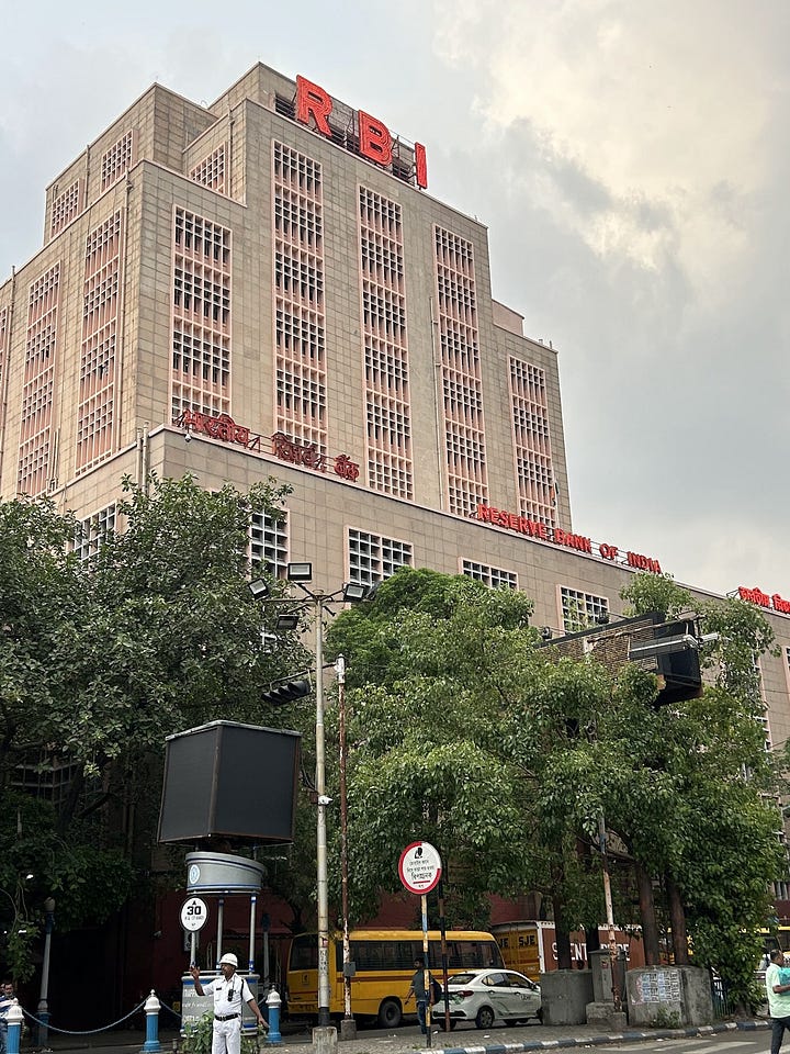 Left: The Reserve Bank of India (RBI) building in Calcutta–seems fairly Soviet to me! Right: Fraternizing with the Communist Party of West Bengal