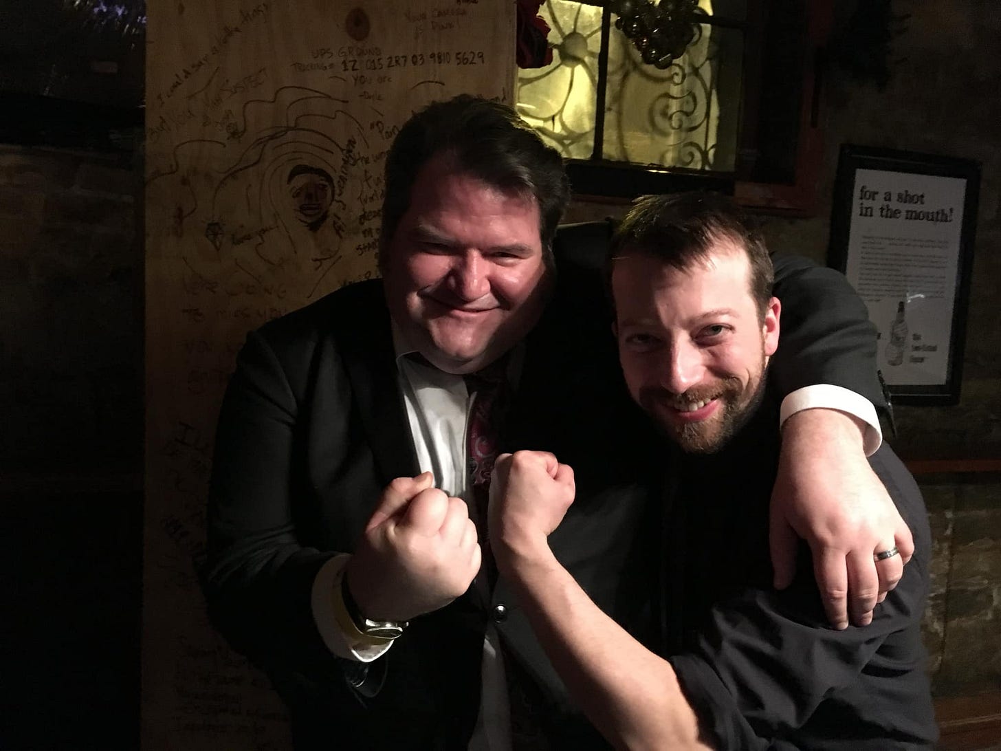 A couple of jagoffs menacing the camera at a dive bar in Chicago.