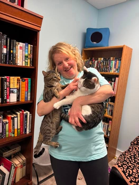 May be an image of 1 person and cat