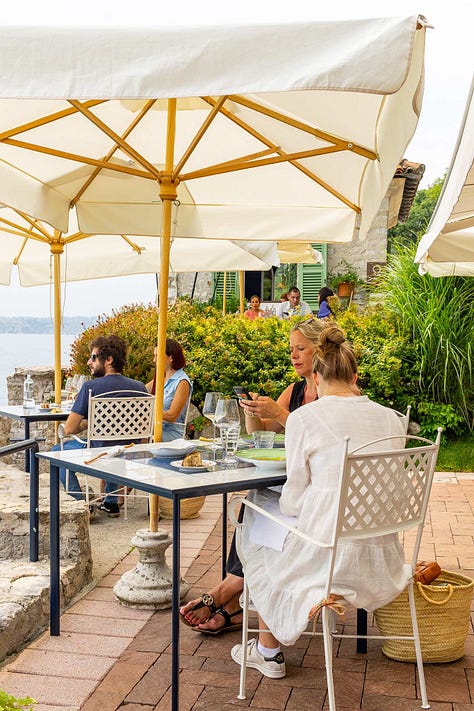Scenes from Ristorante Lido 84's outside terrace overlooking Lake Garda.