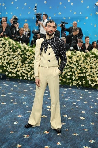 Image may contain Justice Smith Hibo Nuura Tim Storms Person Adult Clothing Footwear Shoe and Electrical Device