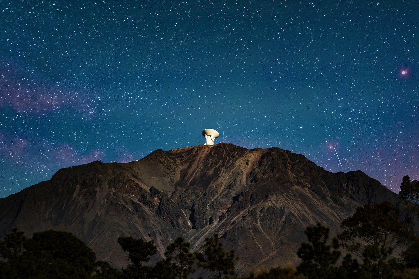 satellite on mountain peak during night time satellite on mountain peak during night time