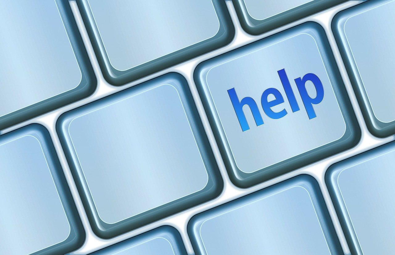 a computer keyboard with the word help
