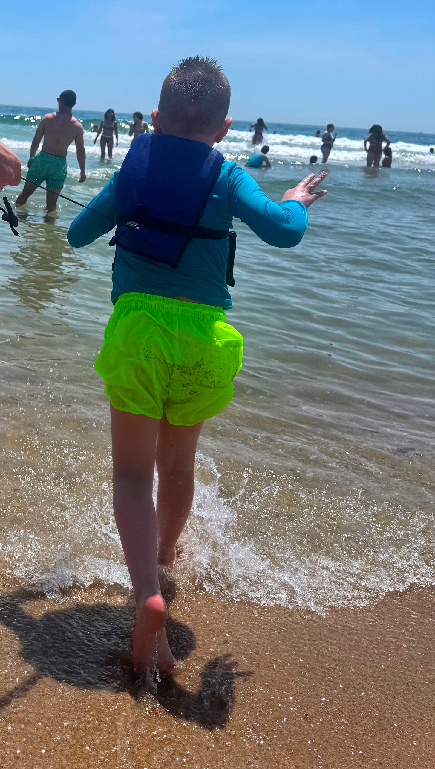 Sarah's profoundly autistic son enjoys a day at a public beach. Sarah's profoundly autistic son enjoys a day at a public beach.