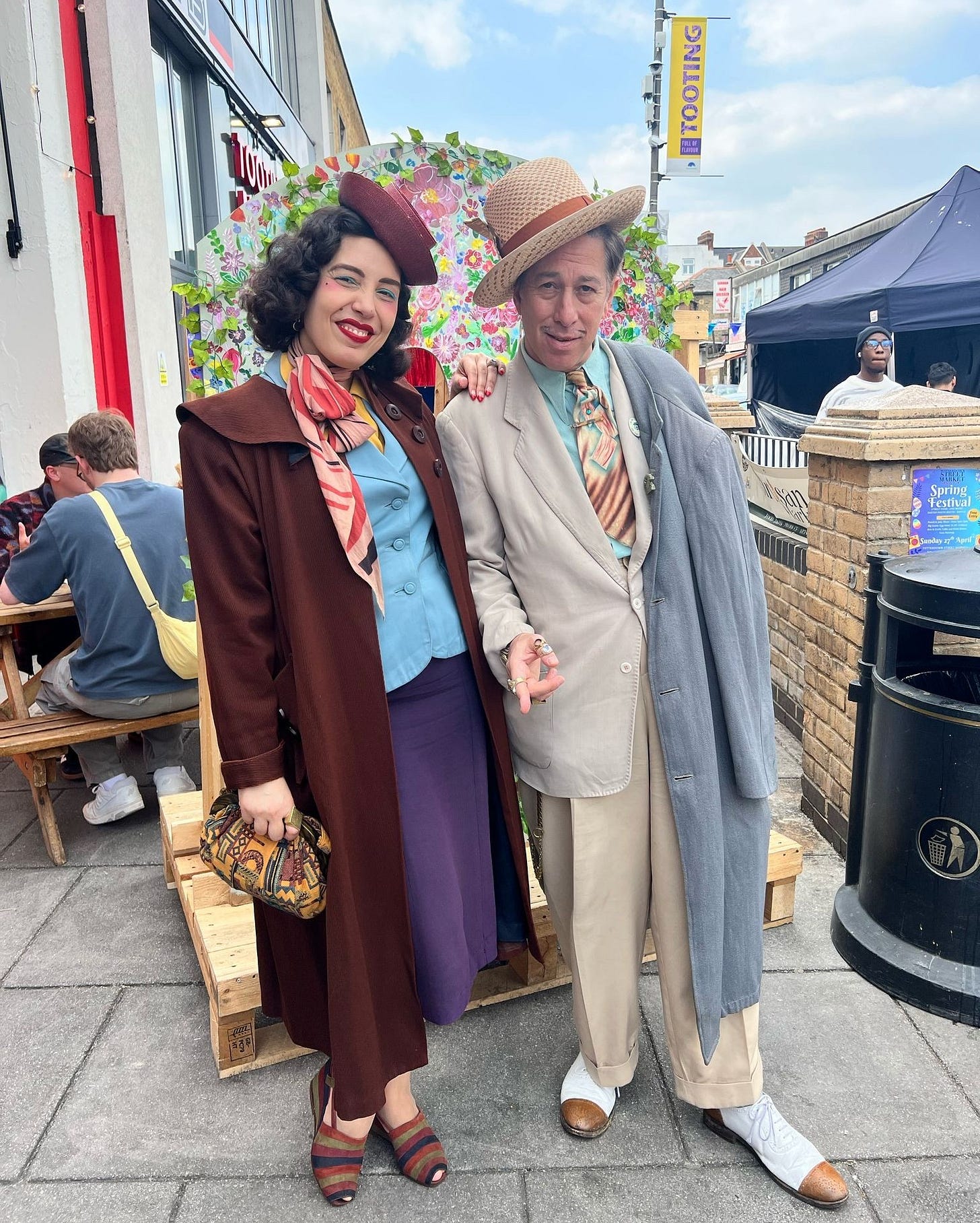 May be an image of 3 people and overcoat