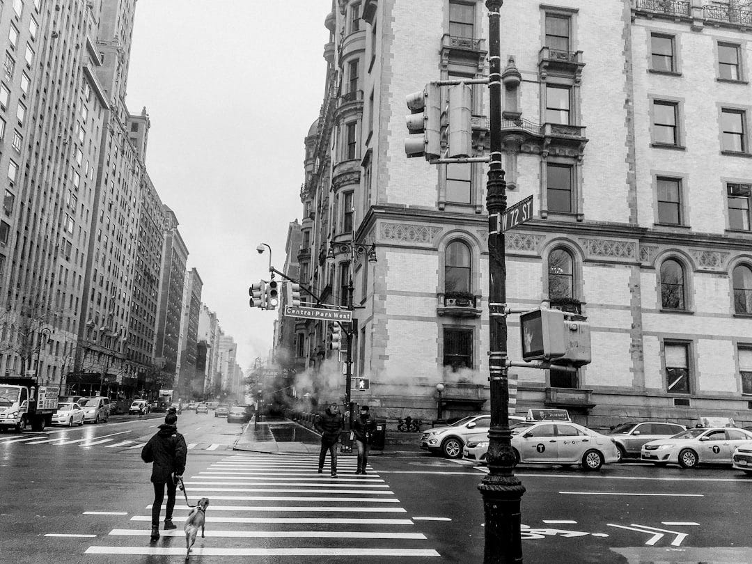 man walking on pedestrian lane man walking on pedestrian lane