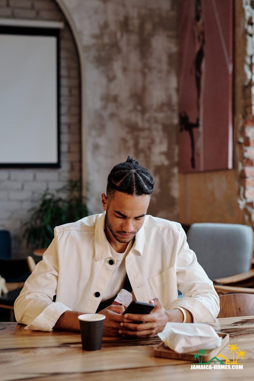 stylish man in white jacket using phone