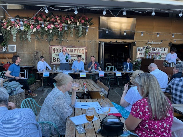 Four images of a political hustings in a pub garden showing candidates taking part in a debate about hospitality.