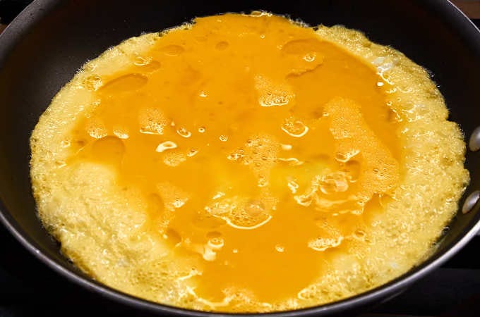 omelette cooking in pan