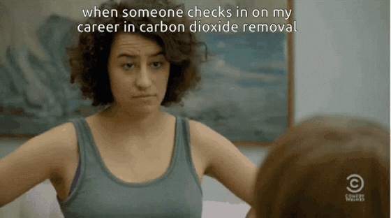 GIF from Broad City of Ilana Glazer in a tank top giving an unimpressed look, a Comedy Central logo in the corner. Text: "when someone checks in on my career in carbon dioxide removal"