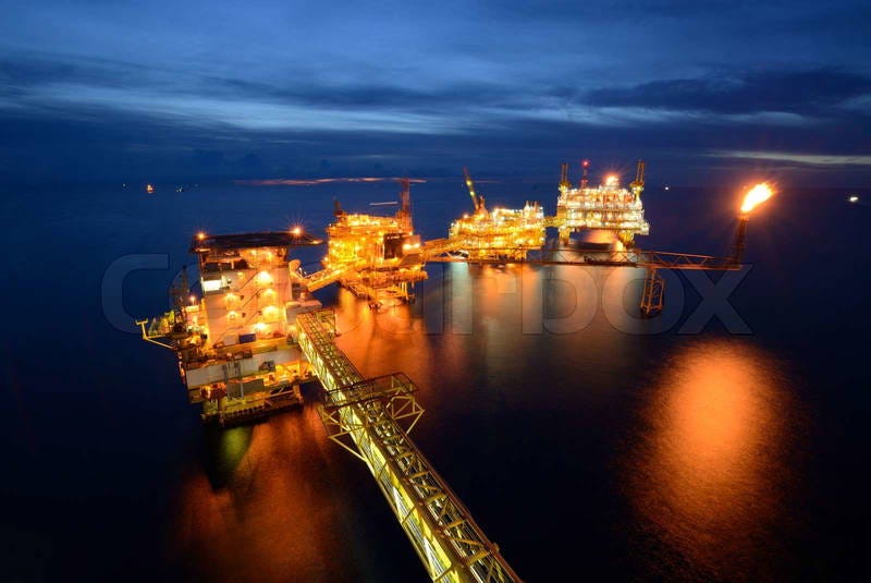 The large offshore oil rig platform at night in the gulf of | Colourbox