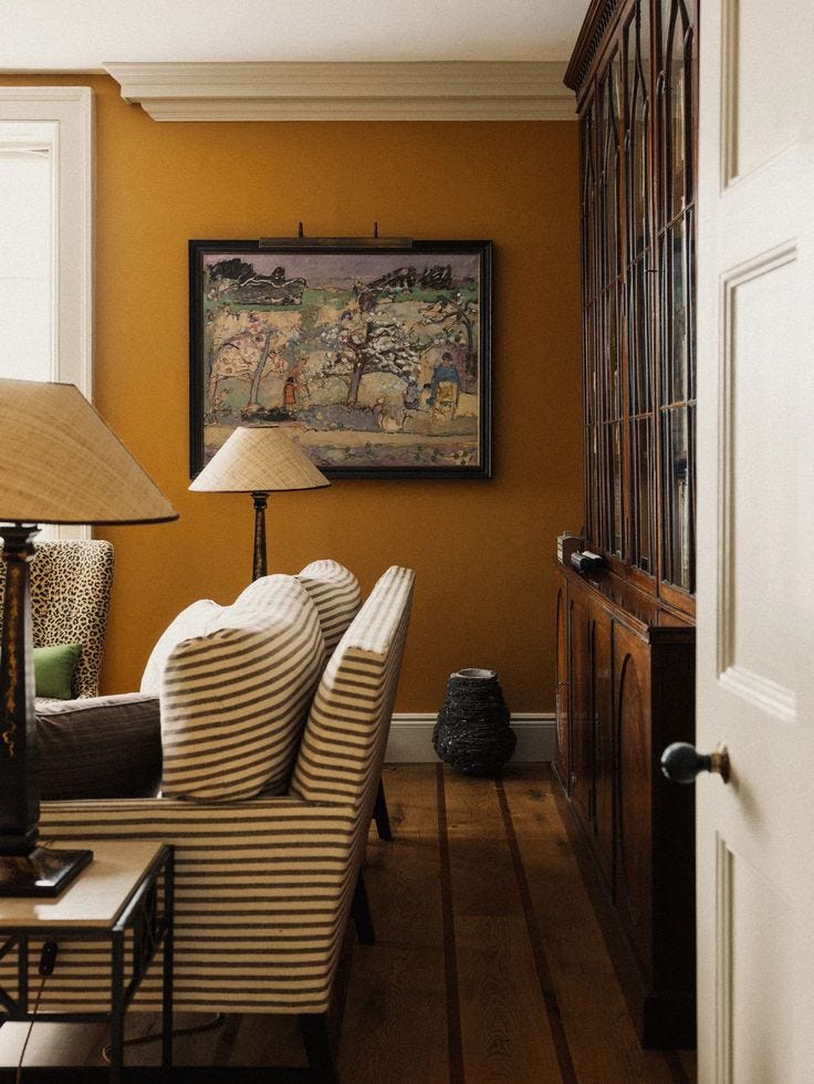 This may contain: a living room filled with furniture and a lamp This may contain: a living room filled with furniture and a lamp