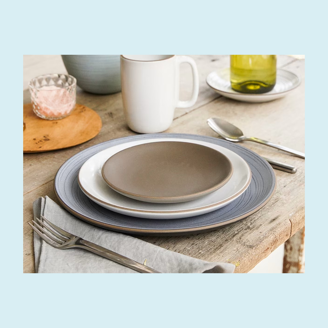 A table place setting with ceramic dishware