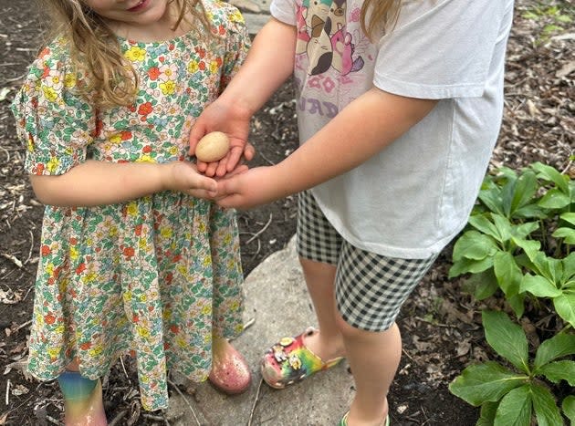 The author's children displaying an egg.