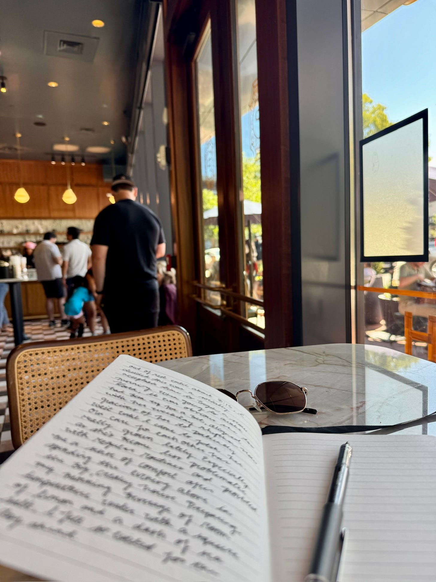 journal at a local cafe with words written on the pages