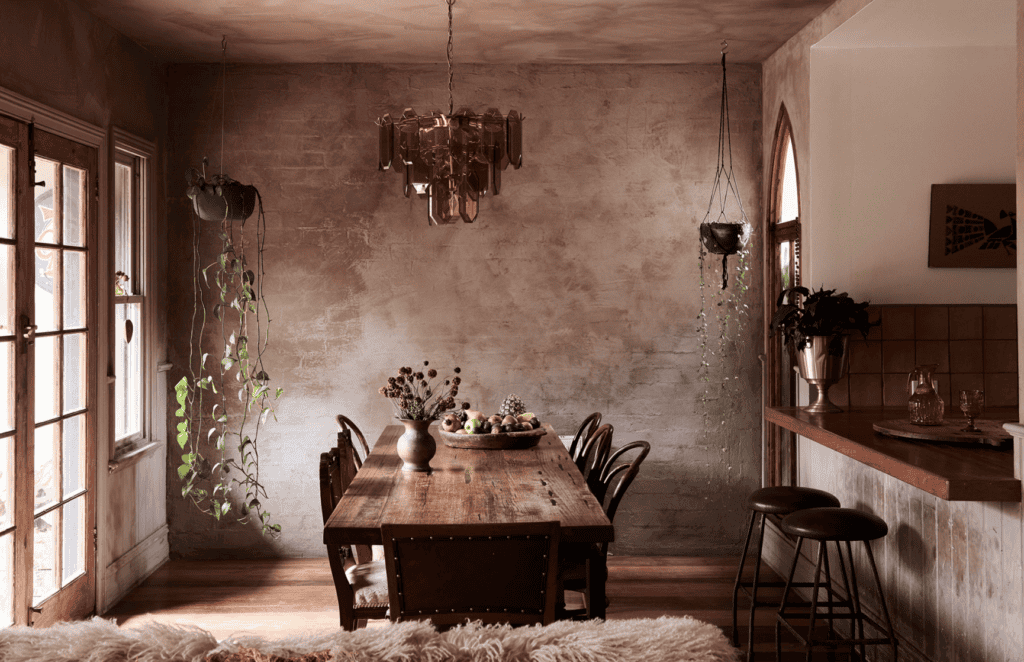 Moody room with some hanging plants.
