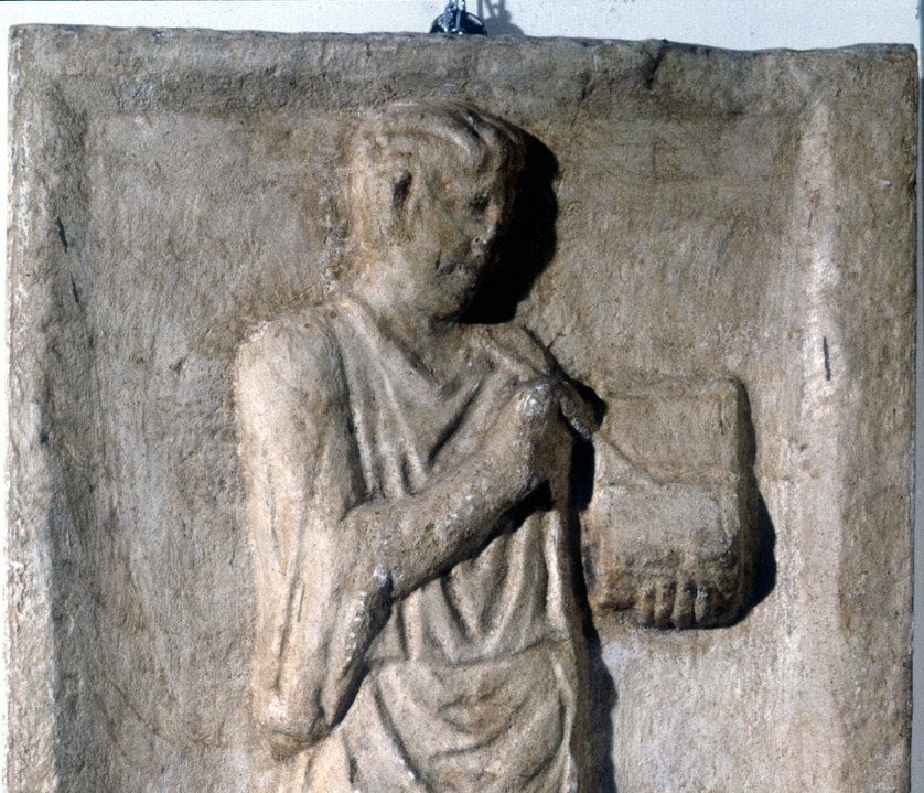 A Man Writing with a Pen on a Wax Tablet A Man Writing with a Pen on a Wax Tablet