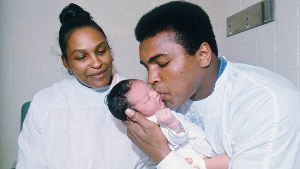 Muhammad Ali Kissing His Newborn Son