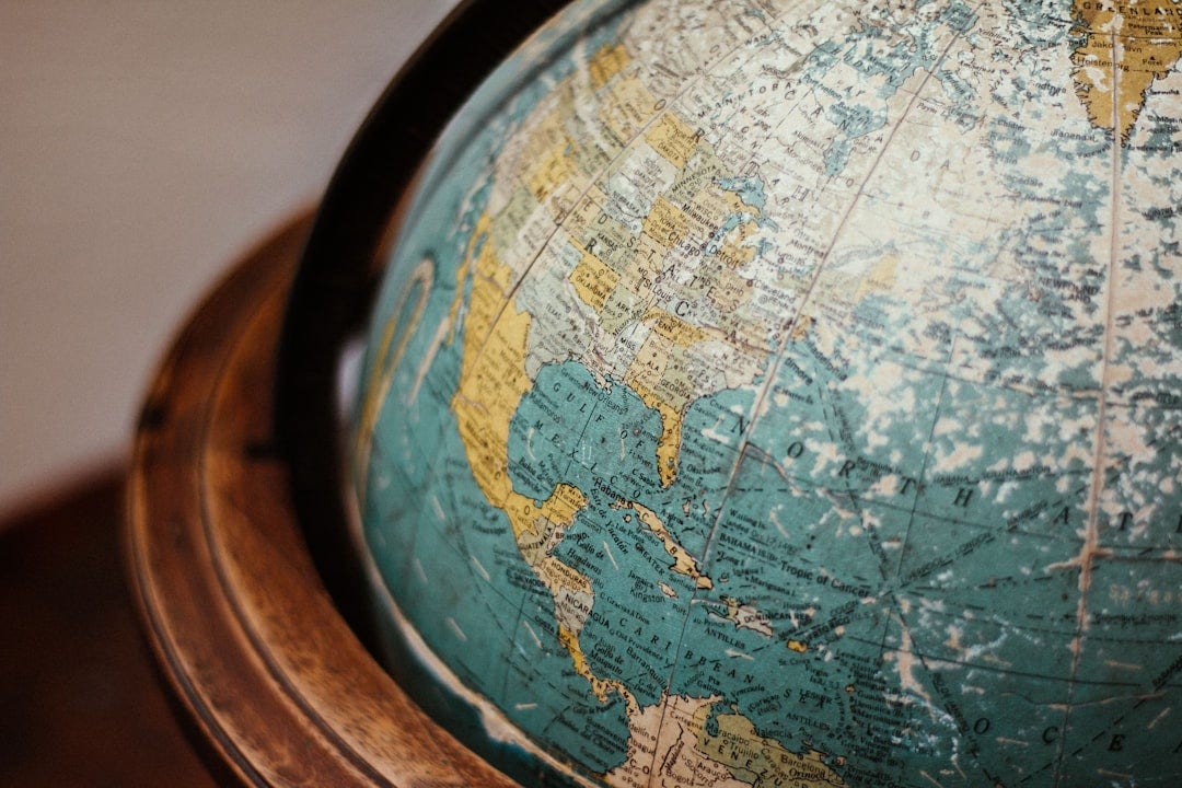 blue earth globe on table blue earth globe on table