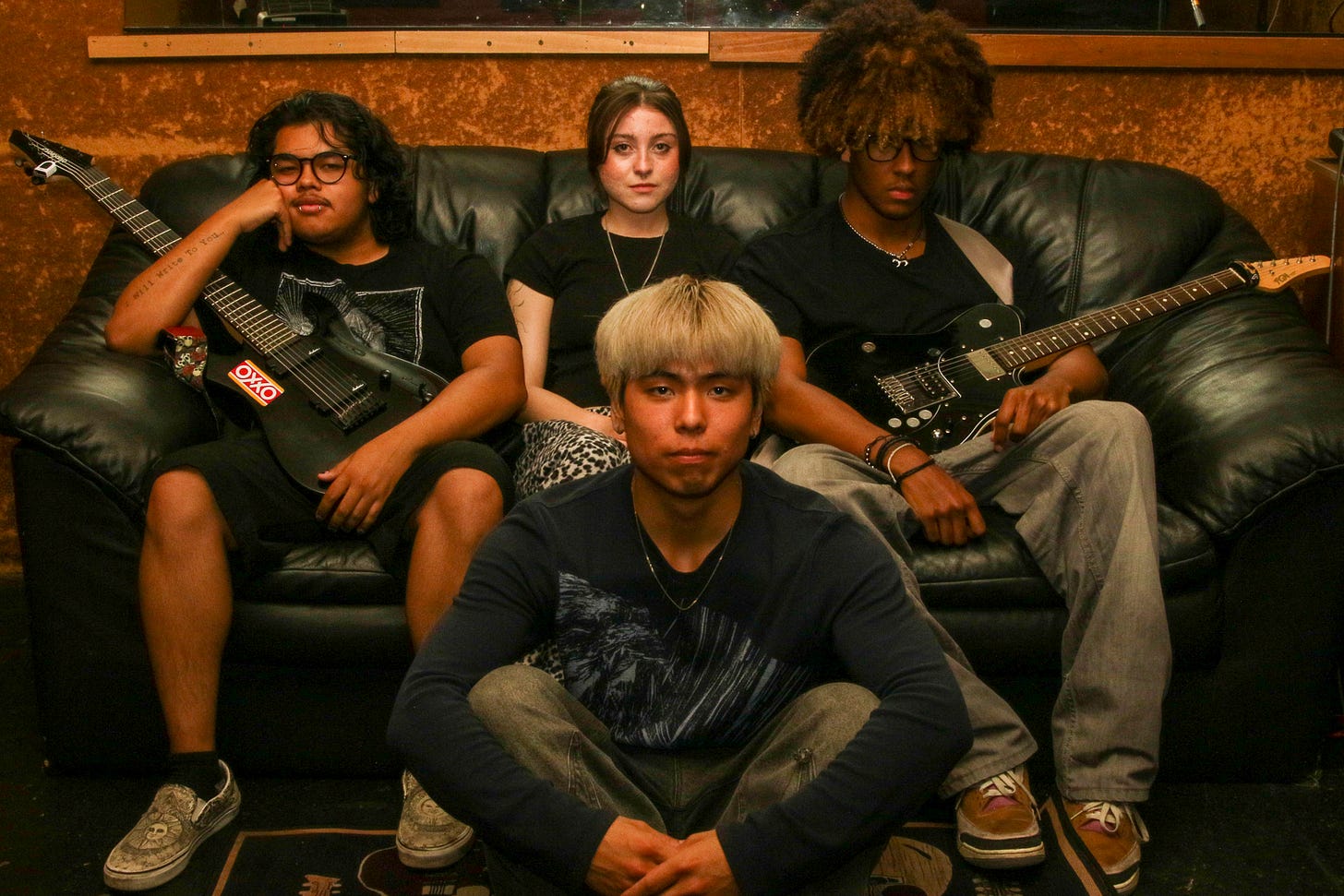 The members of Speaking of Her pose for a photo after a long practice session at Cideshow Studios in Gardena on Thursday, May 8. From left: Guitarist Zeuz Carrillo, vocalist/bassist Josefina Campos, guitarist Masai Garcia and drummer Hanbyoul Lozano (center). (Mario Trejos | Warrior Life)