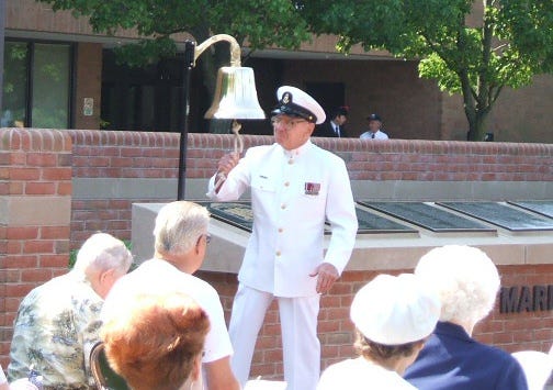 Ringing a bell to honor our fallen servicemen. Ringing a bell to honor our fallen servicemen.
