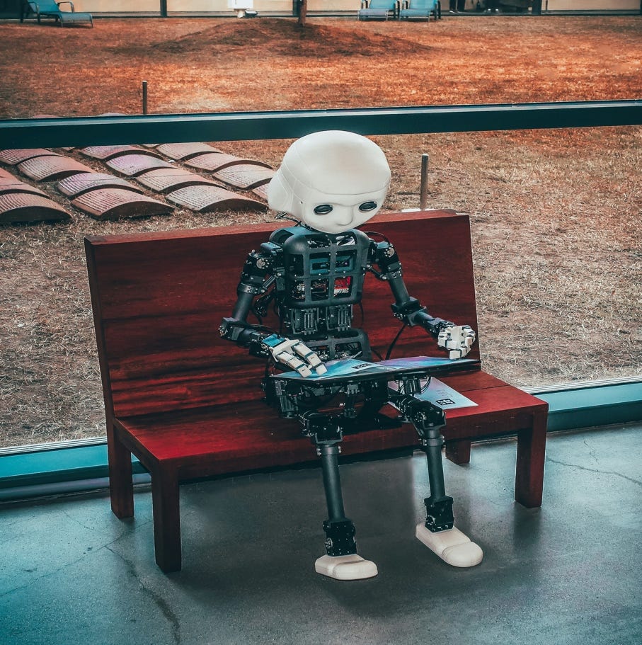 A robot sitting on a bench

AI-generated content may be incorrect.