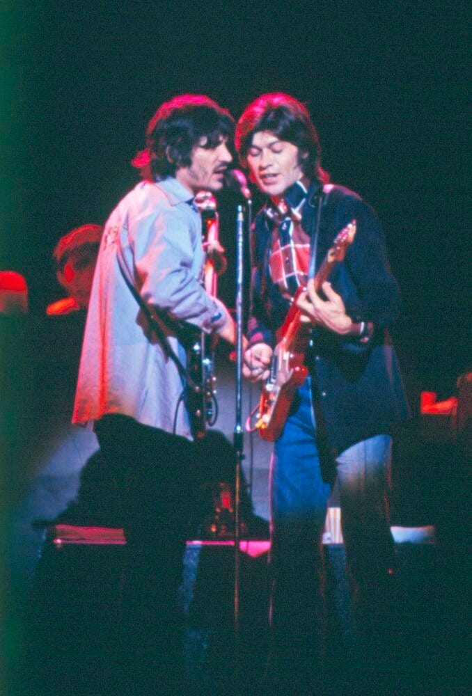 May be an image of 2 people and guitar