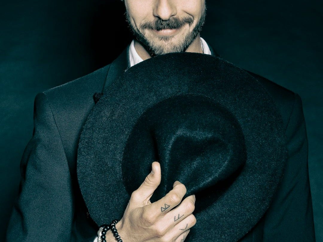 man in black suit jacket wearing black round watch man in black suit jacket wearing black round watch