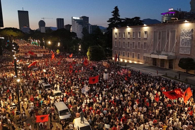 This aerial photograph shows protesters as they demonstrate in front of the Albanian Prime Minister's Office against the construction of a luxury resort near a protected natural area on Albania's southern coast, in Tirana, on July 4, 2026. This aerial photograph shows protesters as they demonstrate in front of the Albanian Prime Minister's Office against the construction of a luxury resort near a protected natural area on Albania's southern coast, in Tirana, on July 4, 2026.