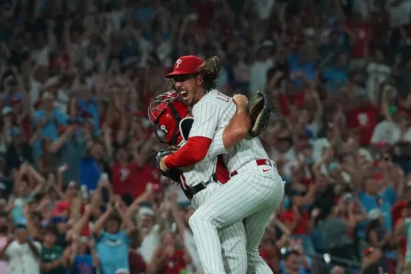 Michael Lorenzen jumping into his catcher's arms