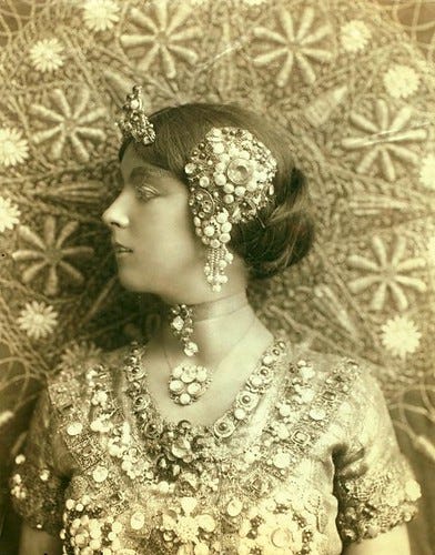 Ruth St. Denis in first costume for Radha. Bust portrait. Ruth St. Denis in first costume for Radha. Bust portrait.