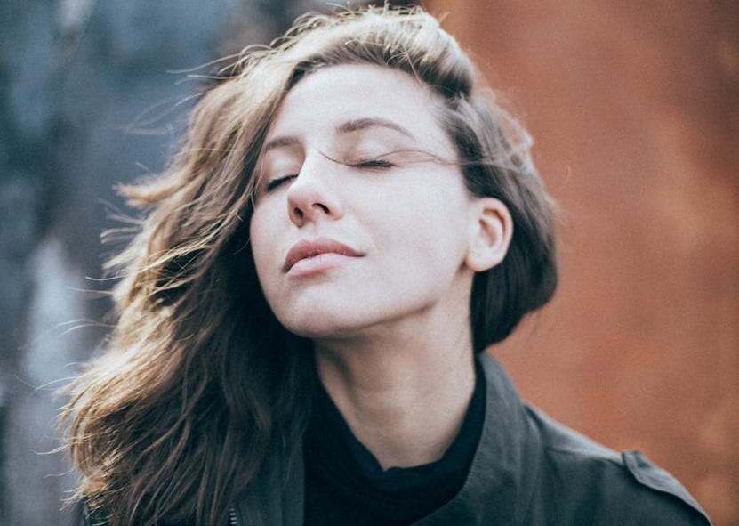 closeup photo of woman wearing black top