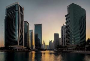 Photo by Anton Massalov - modern skyline of dubai at sunset reflection