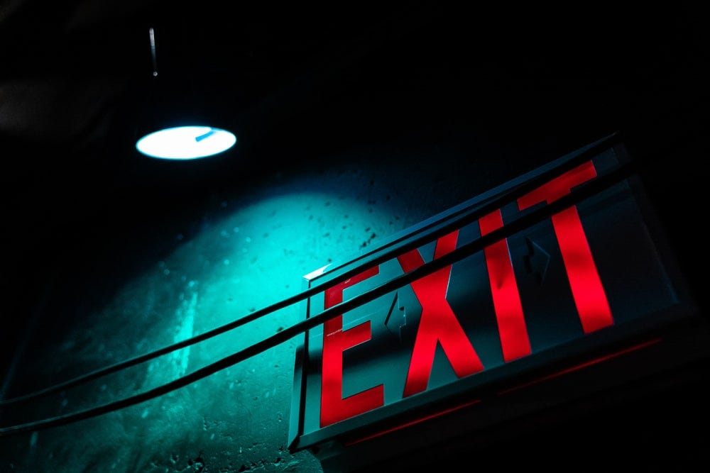 red exit LED signage turned on red exit LED signage turned on