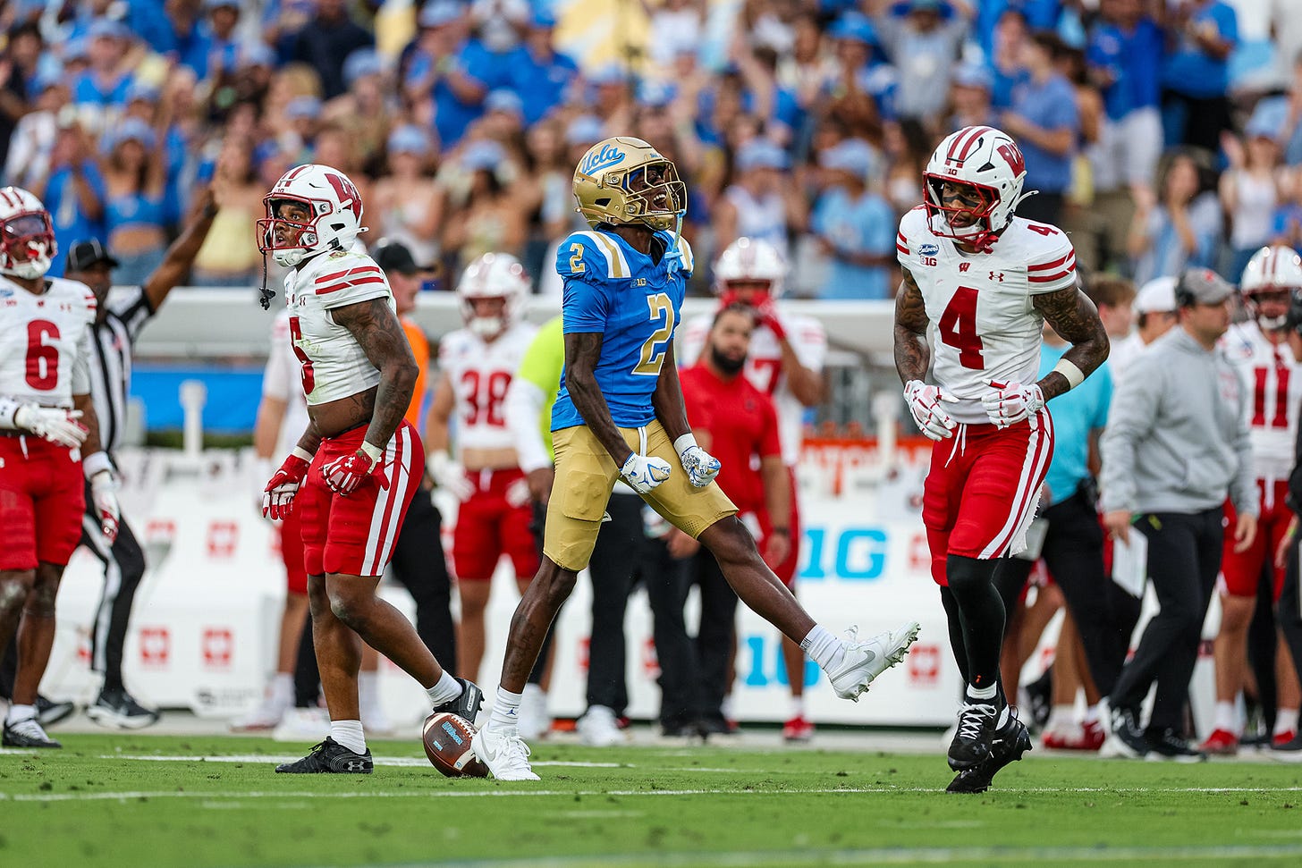 UCLA wide receiver celebrates a reception as Wisconsin defenders react during the Badgers’ 17-7 loss.