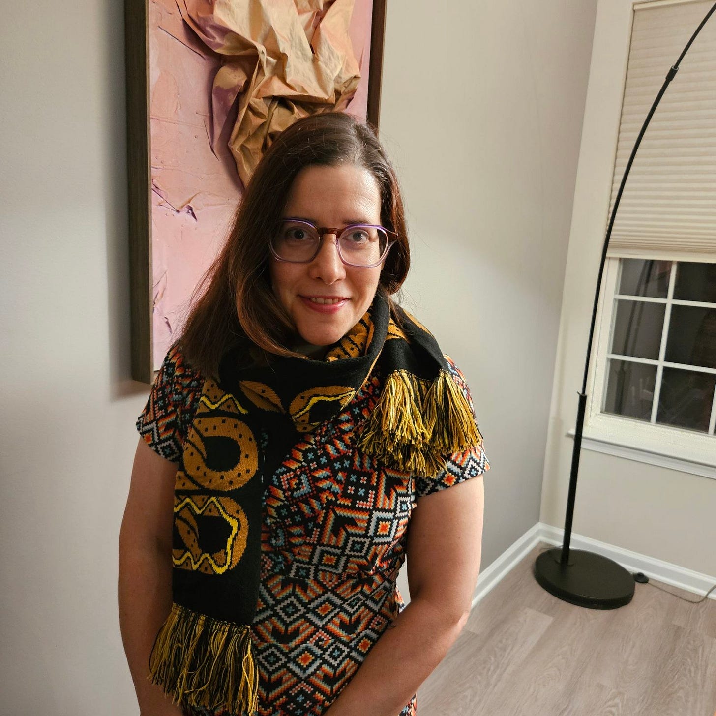 Rachel Kramer Bussel smiling wearing pretzel scarf