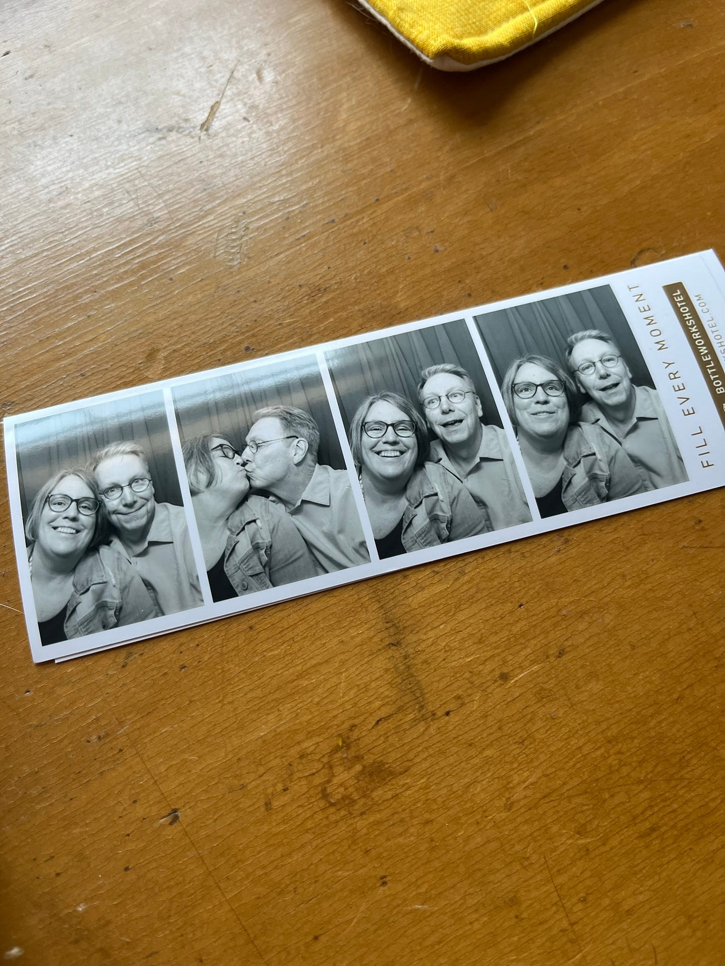 Strip of black and white photo booth pictures of Robyn and Jeff