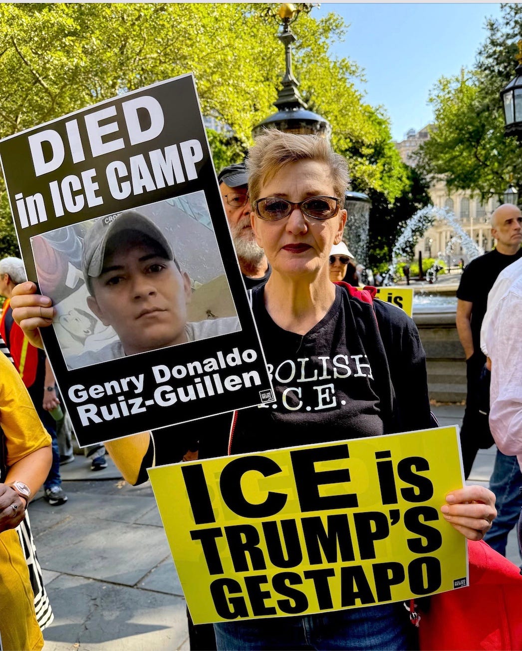 A person holding signs and a picture of a person

AI-generated content may be incorrect.