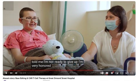 A person sitting in a hospital bed with a child in a mask
Description automatically generated A person sitting in a hospital bed with a child in a mask
Description automatically generated