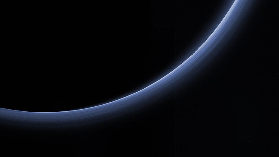 An Atmosphere and a Puzzle Beyond Neptune