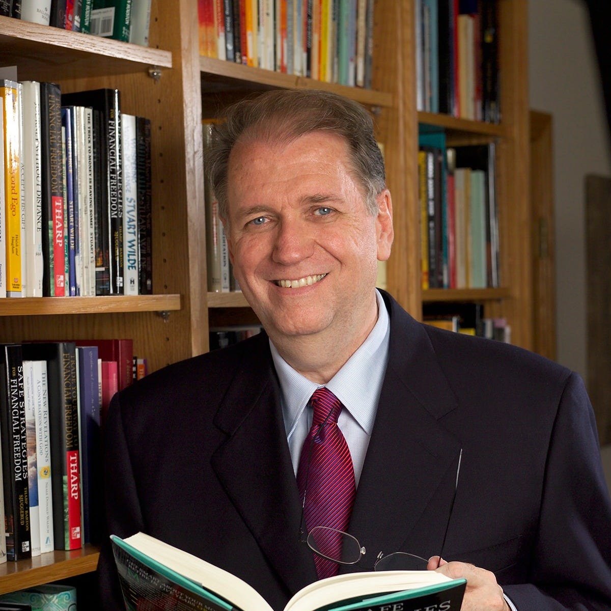 May be an image of 1 person and book