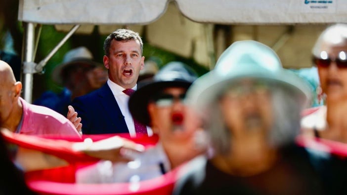 Protesters turn their backs on Act leader David Seymour during his speech at the Waitangi Treaty Grounds marae in 2025.