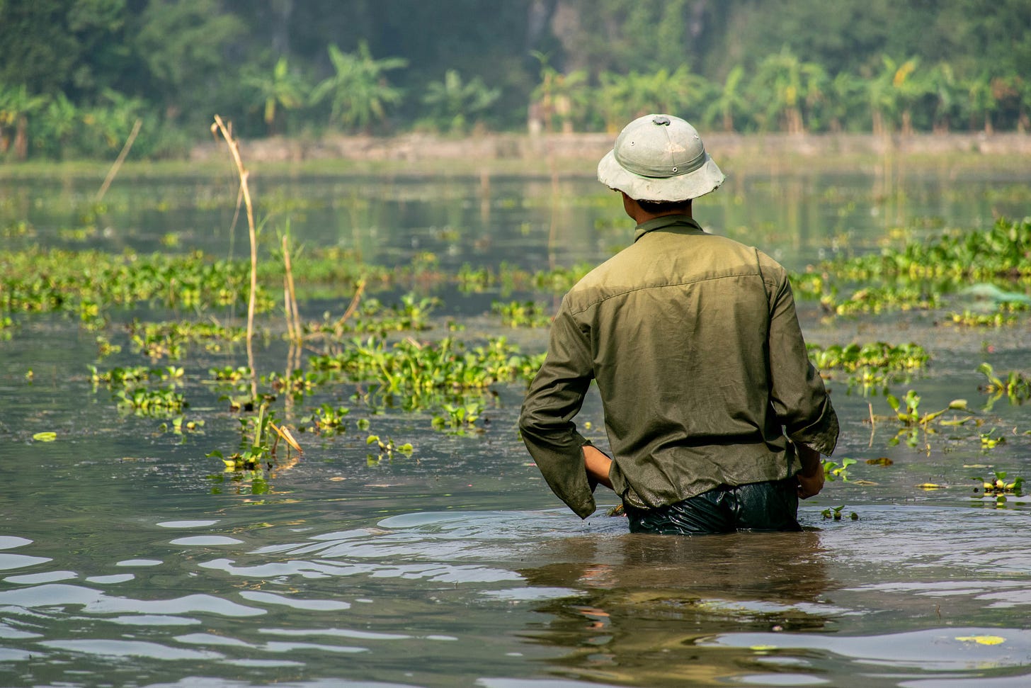 Soldier in a flooded paddy