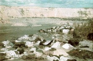 a-german-soldier-reviews-the-vast-quanitity-of-jewish-belongings-confiscated-from-jews-prior-to-them-being-shot-at-babi-yar