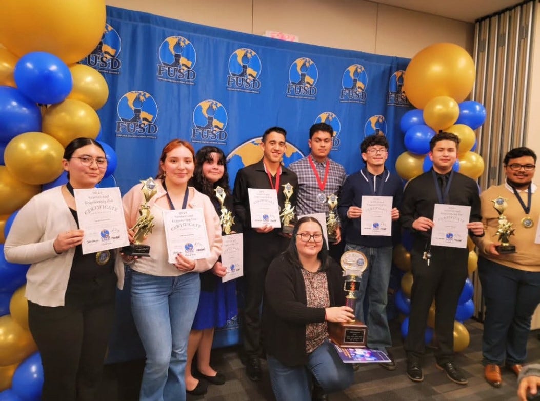 A group of people holding awards

AI-generated content may be incorrect.