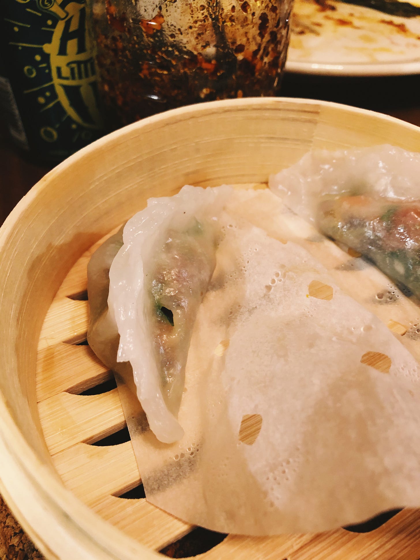 Steamed crystal dumplings in a bamboo steamer