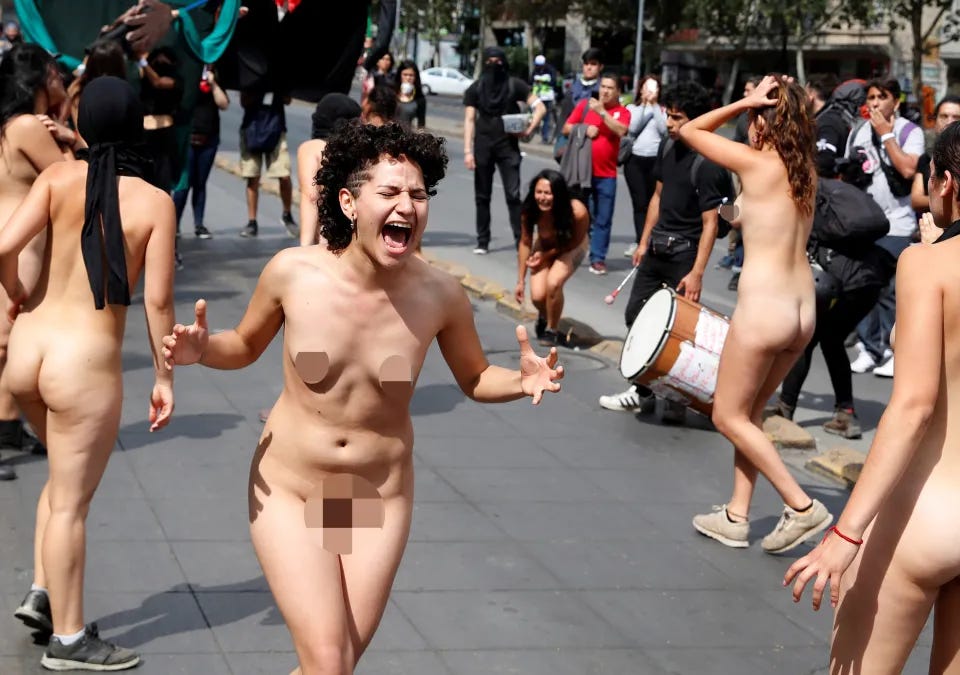 Naked women take part in a rally marking international day to end violence  against women amid ongoing protests in Chile |
