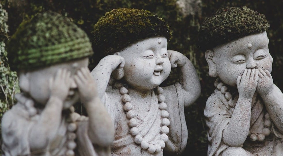 three children sitting statue