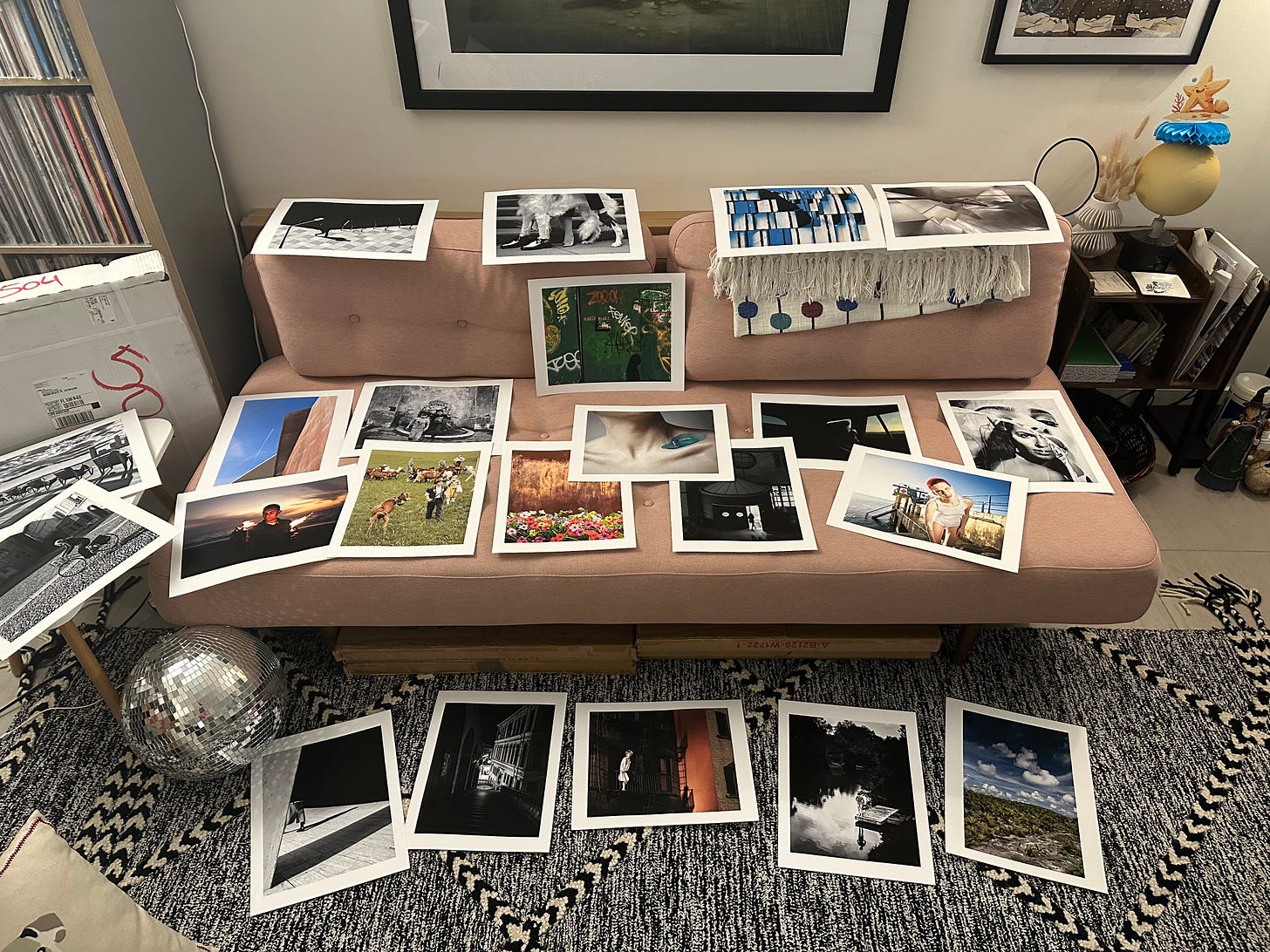 Series of final prints from multiple photographers laid out across a sofa for review before the Miami Art Week show. Series of final prints from multiple photographers laid out across a sofa for review before the Miami Art Week show.